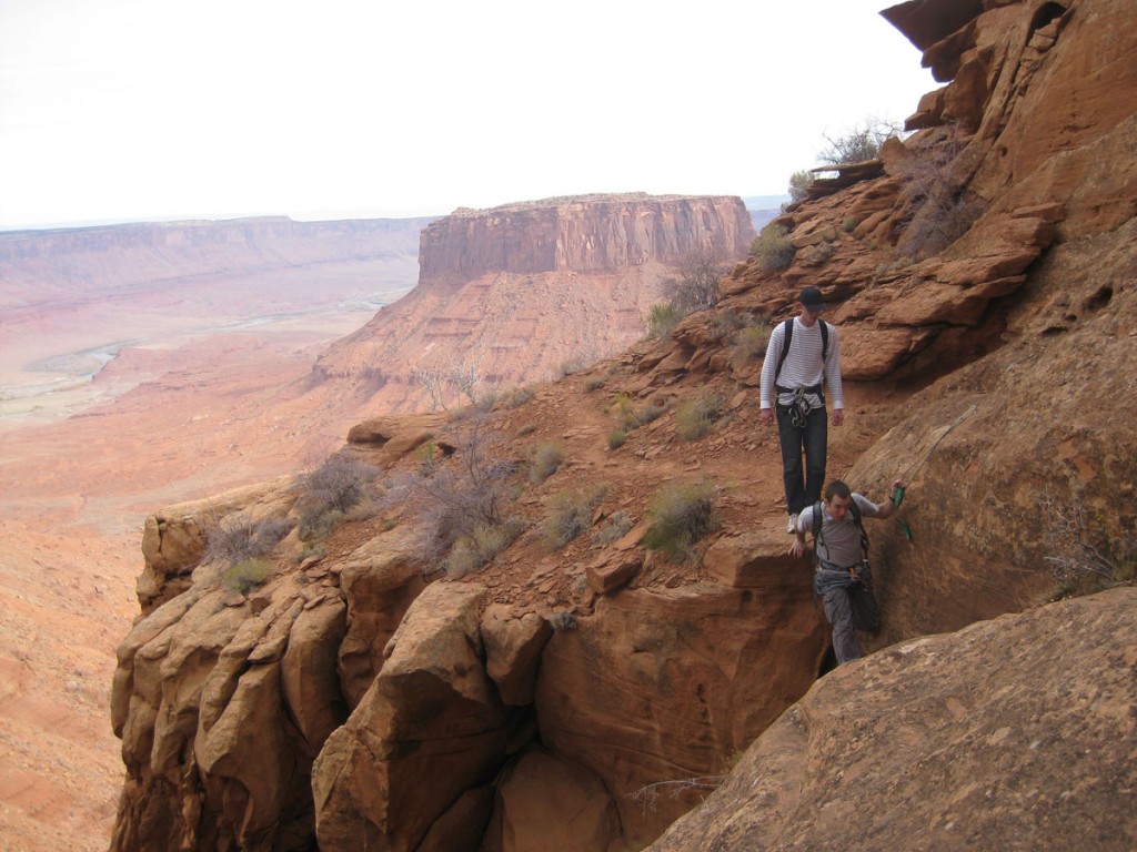 The exposed step across part that has a bolt and sling for you to grab on to.