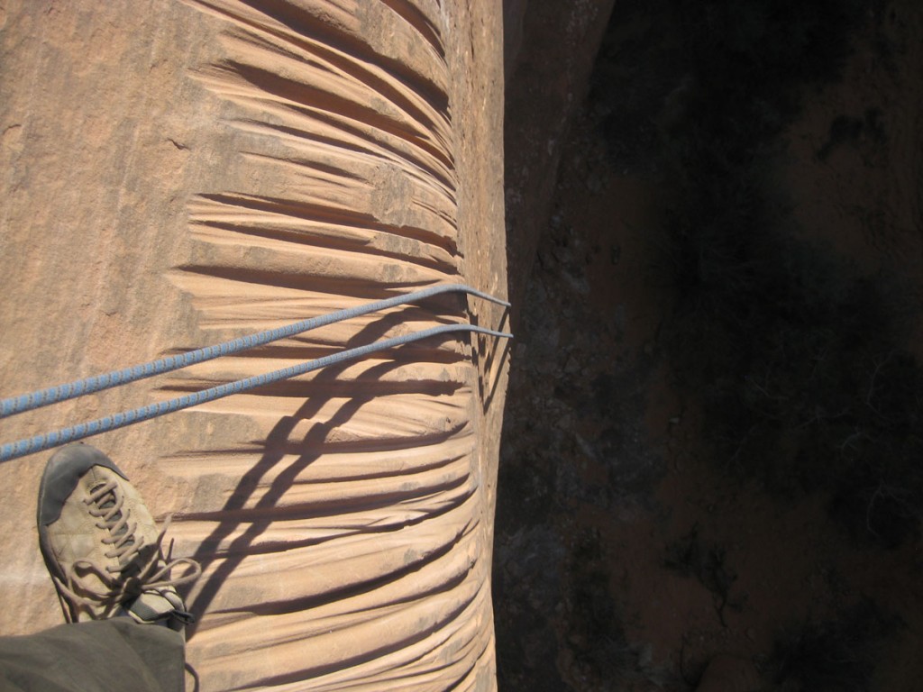 Ugly rope grooves in the soft rock. This is why you need to be careful where you put rappel anchors. Ugly rope grooves in the soft rock. This is why you need to be careful where you put rappel anchors.